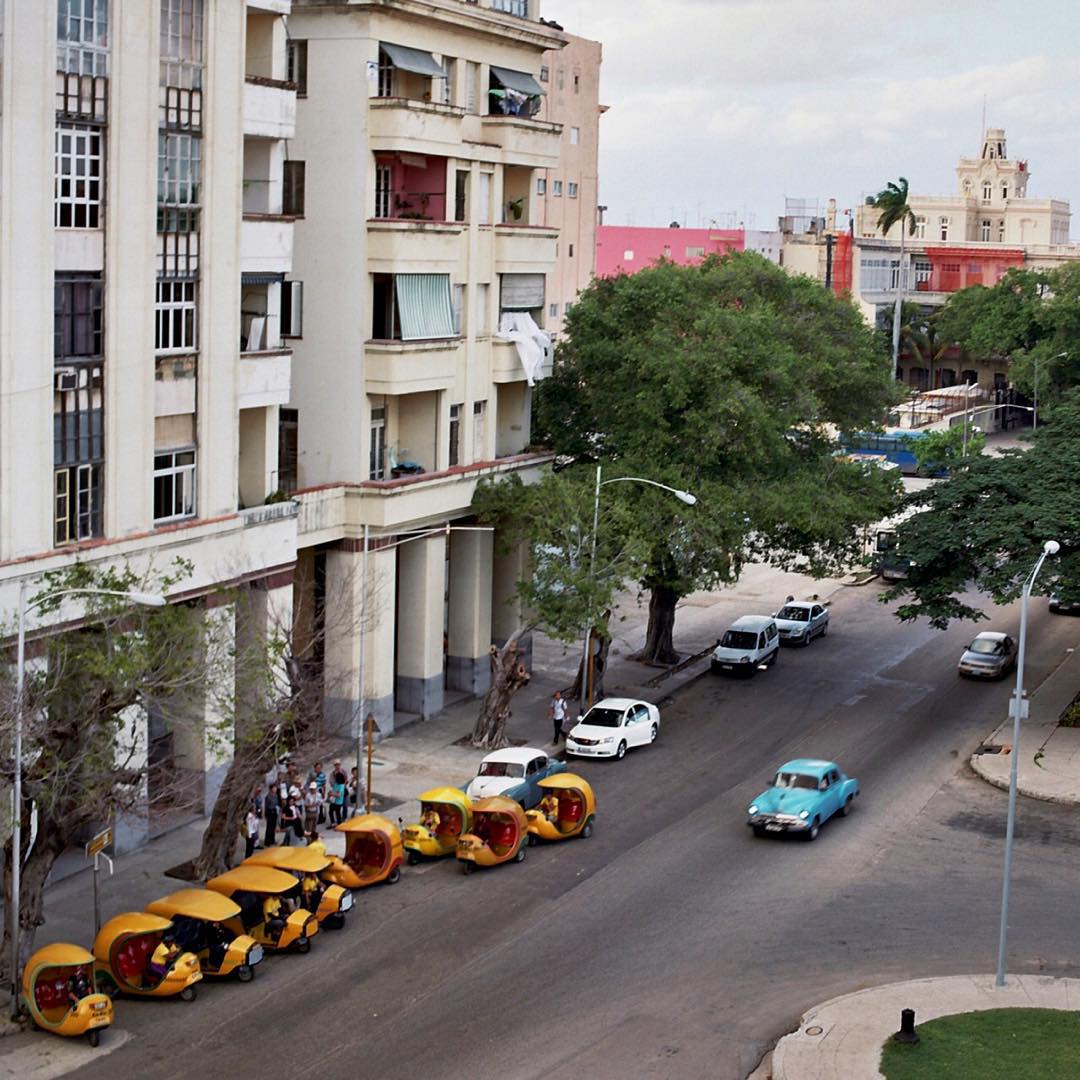 A line of #yellow #cocotaxis and a bit of #classiccar #blue from #museodelarevolucion #Havana #cuba #hasselblad #filmisnotdead #film #kodakportra #120film