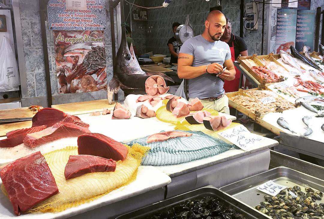 #hunky #fishmonger in #Palermo #fishmarket #sicily #sicilia #italy #italia note giant #swordfish head and #eyeball #thegaypassport